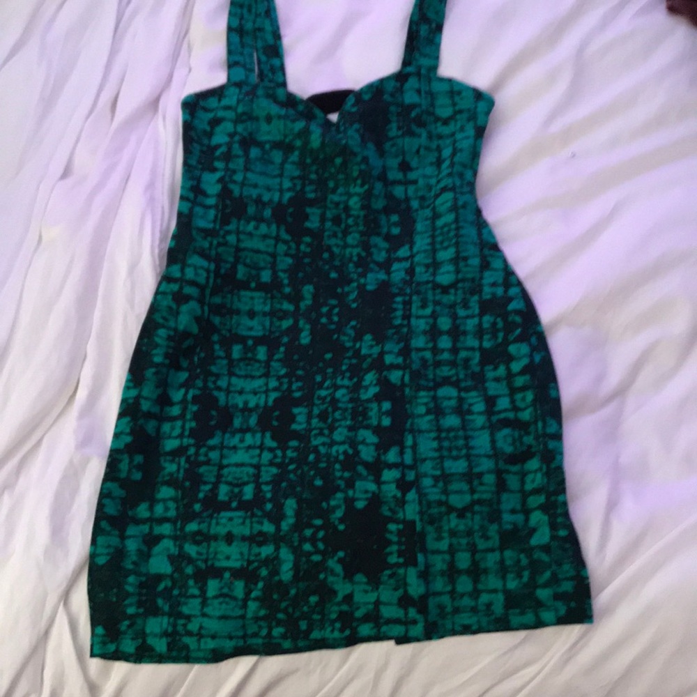 Green and black tight mini dress